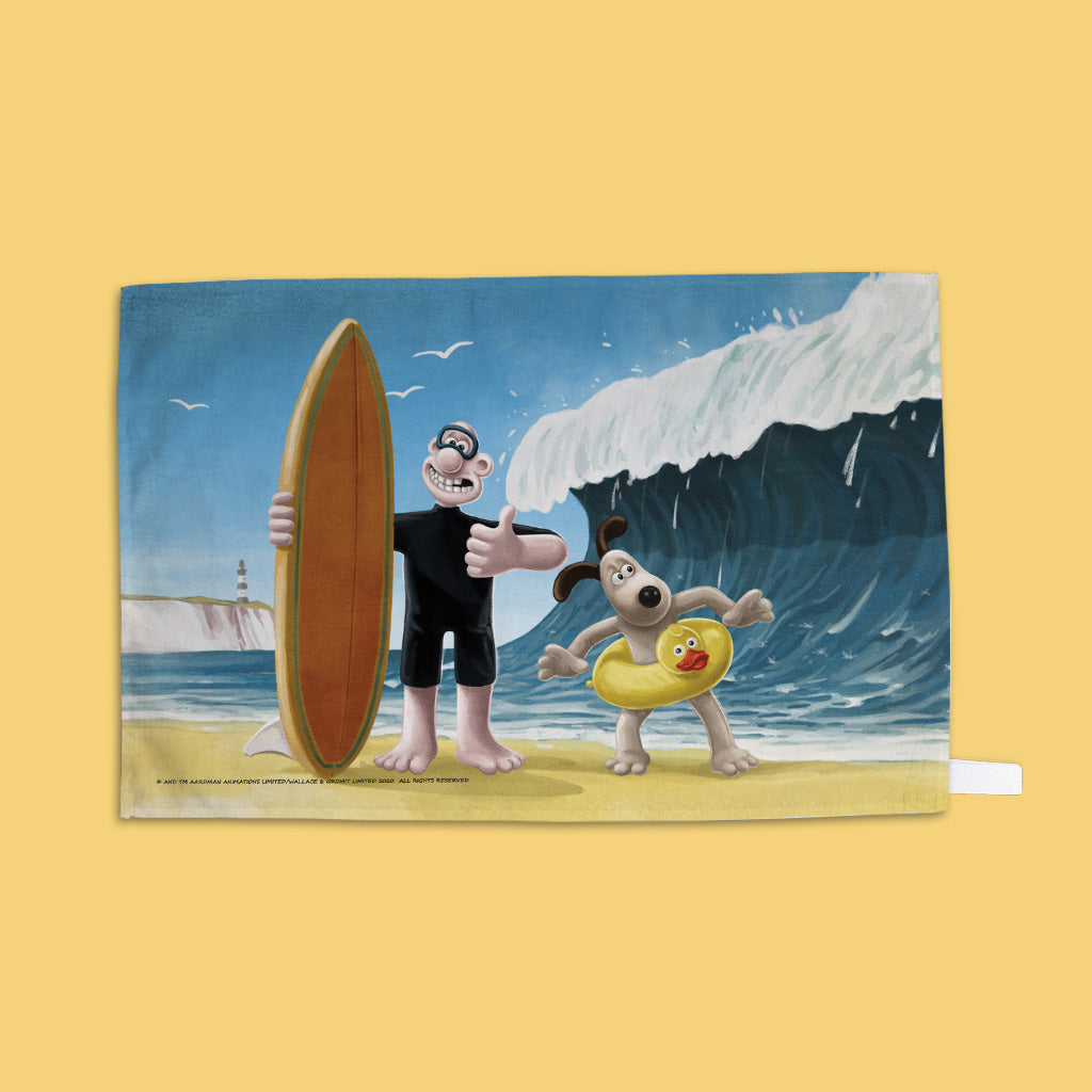 Wallace and Gromit surfing at the Beach Tea Towel